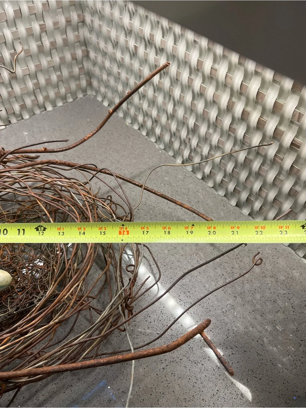 Metal rustic twig nest containing three artificial eggs decorative art